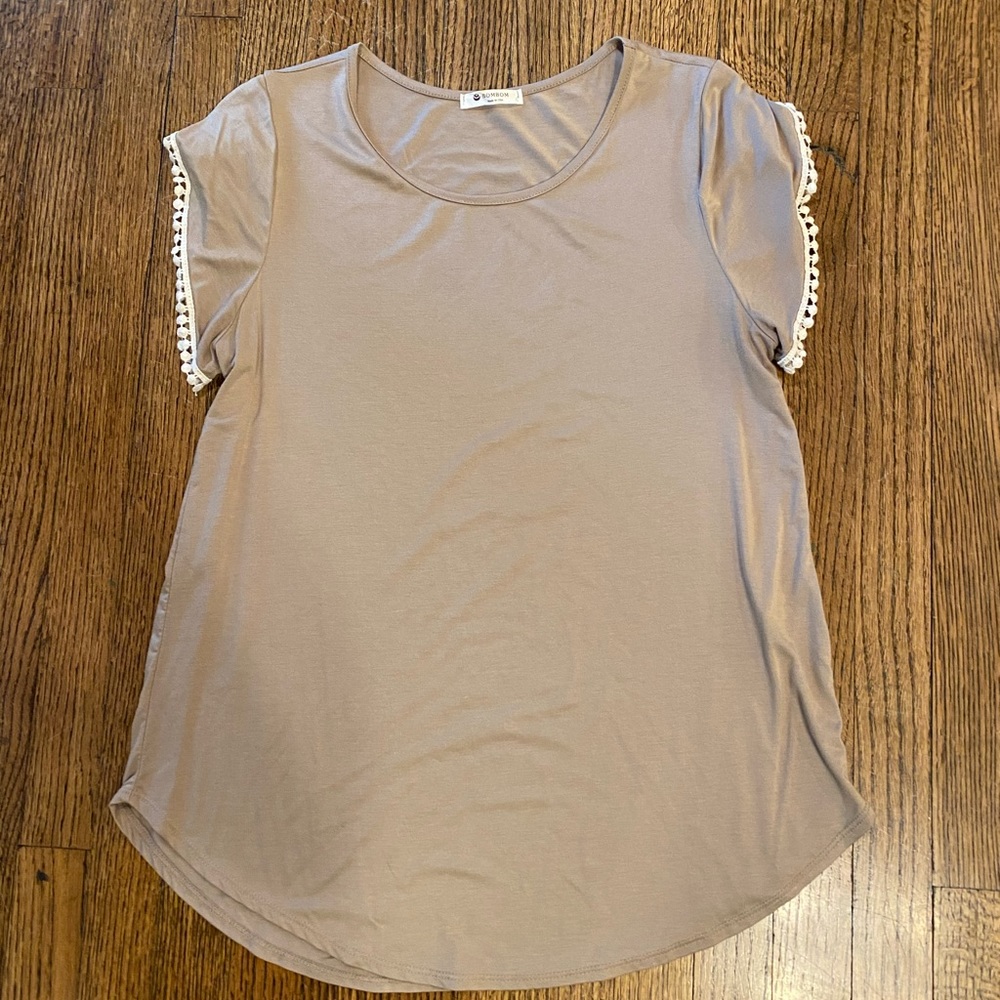 Tan top with crochet detail around sleeve